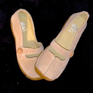 Brown leather Mary Jane shoes.